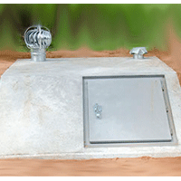 Underground storm shelter with ventilation and access door installed by Scott Construction & Excavation